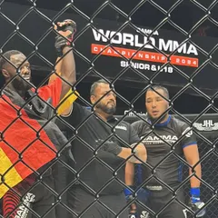 In the cage, officiating a bout at the World MMA Championship. My experience as a judge and referee gives me a unique perspective that I bring back to my fighters' training.