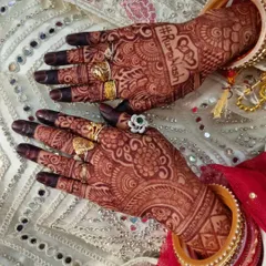 A wedding hashtag is a great personal touch to add to your bridal henna. This design features the couple's hashtag, #RumaNash, elegantly written into the palm.