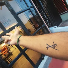 A simple and stylish custom name tattoo. I can create a unique font design like this one for you in just a minute. It's a popular choice for people who want to try out a name design before committing to a permanent one.