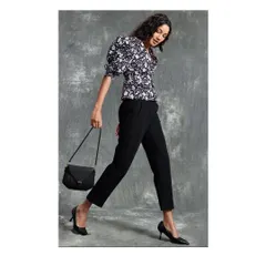 A chic, casual look from a Spring Summer campaign. I styled a floral puff-sleeve top with classic black trousers and heels, creating a versatile outfit that is perfect for a stylish day-to-night transition.