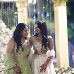 Styling sisters is about celebrating their unique bond. Here, I chose coordinating raw silk lehengas by Mirroir in complementary beige and mint green. The looks are harmonious, yet each sister has her own distinct style, creating a beautiful picture of togetherness.