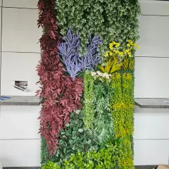 This artificial vertical panel shows a mix of purple, yellow, and red foliage. I use these custom arrangements to add color and break up the monotony of a plain interior or exterior wall.