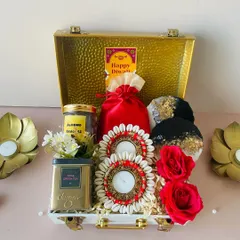 One of our bestsellers, this premium metal trunk hamper is the definition of affordable luxury. It's packed with Diwali delights like shell-work diyas and gourmet tea, making it a memorable gift for clients and employees.