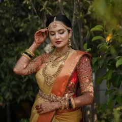 A candid moment of Taanya during her wedding ceremony, looking serene and beautiful.