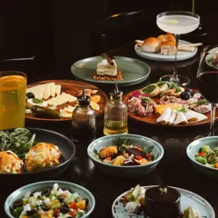 A glimpse of our lavish Sunday Brunch spread. This is more than a meal; it's a table full of stories waiting to be shared, featuring everything from fresh salads and artisanal cheese boards to decadent desserts.