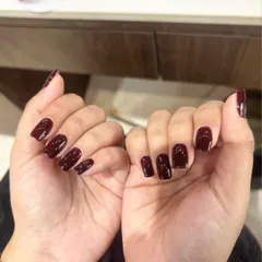 A classic color with a modern twist. This deep, vampy burgundy polish has a rich, glossy finish that is perfect for a sophisticated yet bold statement on perfectly shaped square nails.