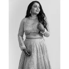 A timeless black and white portrait of the bride, Amruta, looking stunning and elegant in her reception lehenga.