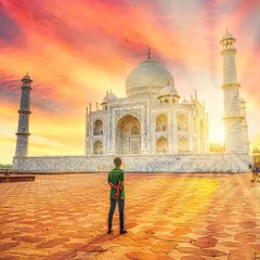 A solo portrait capturing the grandeur of the Taj Mahal during a fiery sunset. I edited the colors to enhance the dramatic sky, making the monument a co-star in the photo.