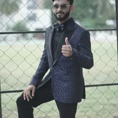 This blue patterned tuxedo with a matching bow tie is perfect for making a statement at evening events. A great outfit gives me the confidence to command the stage.