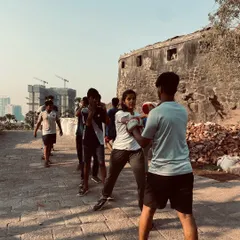 An instructor provides personalized feedback during a pad work drill at our community training event. This hands-on coaching ensures that every participant, regardless of age or skill level, learns the correct technique.