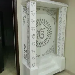 The same mandir design shown without the backlight, highlighting the clean white finish and detailed CNC cutting.
