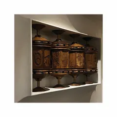 In a transitional passageway, we commissioned this Buddhist Prayer Wheel-inspired sculpture. Each wheel is meticulously hand-carved with depictions from the life of Shiva, creating a modern, poetic, and interactive art piece.