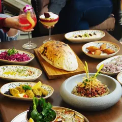 A feast for your eyes, camera, and palate. We believe in creating beautifully plated dishes, like this lavish spread of Turkish and Mediterranean mezzes, that awaken all your sensory experiences.