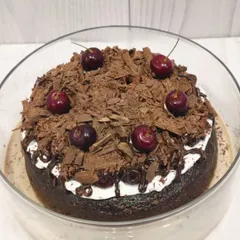 This view shows the cake sitting in its bath of sweet milk, a signature of the Tres Leches style. It ensures every single bite is perfectly moist and flavorful.
