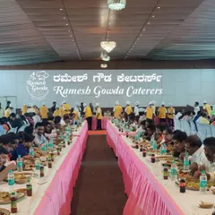 Another view of a large-scale event with our team serving guests. The pink table skirting and organized seating show how we manage the aesthetics of the dining area as well.