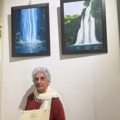 A truly proud moment for us and our student. Harinder ma'am receiving her participation certificate at the 'Magic with Every Stroke' exhibition for her beautiful waterfall paintings.