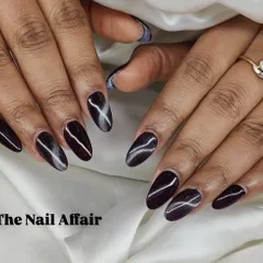 Another look at the dark cat eye nails, showing the sharp, diagonal line of light created by the special magnetic polish.