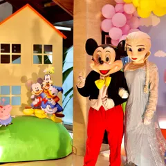 Character mascots make every party more magical. Here, Mickey Mouse and Queen Elsa from Frozen are ready to greet guests and pose for photos at a Peppaland-themed birthday celebration.