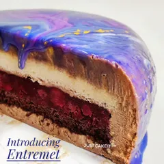 I also create luxurious French desserts like this egg-free Entremet. This cross-section reveals the complex layers of creamy mousse, rich cake, and fruit jelly that make each bite a unique experience.