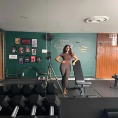 Leaning on the bench after a tough set. The gym is my sanctuary and my playground.