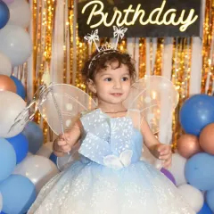 A magical portrait of the birthday girl dressed as a fairy, complete with a wand and wings. I love creating these special, posed shots that capture the theme of your child's party and their adorable personality.
