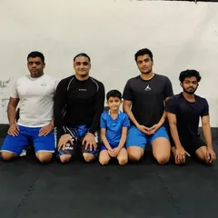 It takes a village. This photo captures the mix of adults and kids that make up our diverse and welcoming BJJ family.