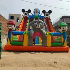 Another angle of the multi-character bouncy castle, showing the vibrant colors and detailed figures that make it a major attraction.
