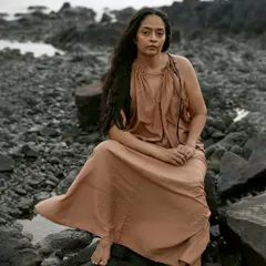 A quiet moment of reflection amidst the rocks. This image is from a spontaneous beach session where we let the mood guide us, resulting in a series of raw and authentic portraits.