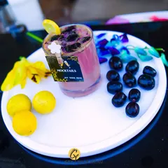 A refreshing Jamun mocktail, perfect for a summer event. The deep purple of the fruit creates a visually stunning and delicious drink.
