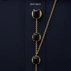 A closer look at our bespoke shirt buttons. Linked by a delicate gold chain, these gemstone buttons are designed to complete your look with a touch of unique elegance.