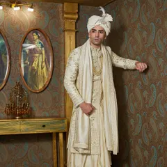 The full silhouette of my ivory sherwani, showcasing the elegant drape of the fabric and the coordinated stole. Every element is designed to create a majestic presence for the groom on his wedding day.