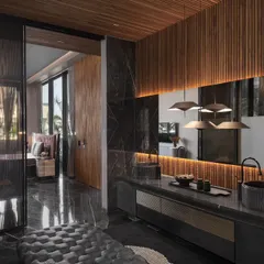 A seamless integration of a bedroom and restroom, connected by a sleek glass door. This innovative design maximizes space and light, with a modern material palette of dark marble and fluted wood for a sophisticated feel.