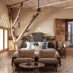 My design philosophy is rooted in bringing nature indoors. In this guest room, a preserved tree branch becomes a central feature, complemented by a custom headboard and locally inspired textiles on the ceiling, creating a space that is both rustic and refined.