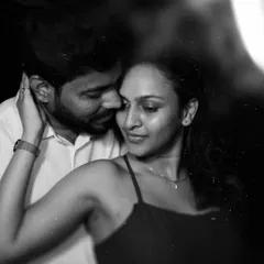 An intimate black and white portrait from a night shoot on the beach. The focus is purely on the couple's connection, creating a timeless and emotional image.