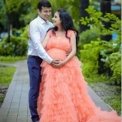 Celebrate your beautiful journey to motherhood with our peach ruffle maternity gown. Designed for comfort and style, its voluminous layers create a soft, dreamy silhouette perfect for capturing this special time. This rental gown ensures you look and feel like a queen during your maternity photoshoot.