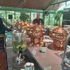 We believe presentation is just as important as taste. Here is one of our elegant buffet setups featuring our signature copper serveware, perfect for making a statement at corporate family days and annual functions.