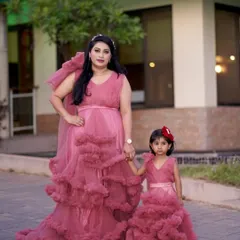 I love seeing families twin in my outfits. This beautiful mother and daughter are wearing my matching dusty rose gowns, a popular choice for family photoshoots, birthday parties, and special celebrations.