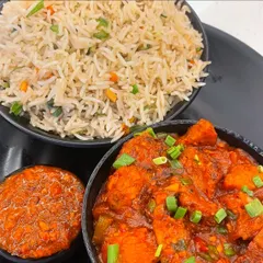 My Manchurian Chopper Rice is a crowd-pleaser. It features flavourful fried rice topped with a generous portion of spicy and tangy Manchurian gravy, garnished with fresh spring onions.