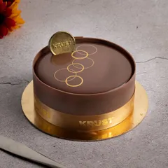 My signature Belgian chocolate truffle cake, featuring a flawless mirror glaze and elegant gold accents. I use only high-quality Belgian chocolate to achieve this rich flavour and luxurious finish, making it a perfect cake for any celebration.