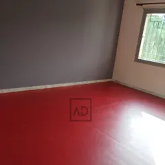 The finished room with the 6mm red sports flooring. It transforms a regular room into a dedicated space for fitness, dance, or sports practice.