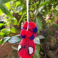 Another angle of our hanging Spider-Man toy, showing the detailed stitch work on his mask and suit. It's a fun and unique piece for any superhero fan.