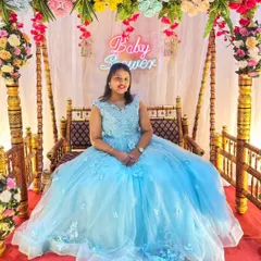 Feel like a princess at your baby shower in this dreamy sky blue ball gown. The full tulle skirt and delicate floral details make it the perfect choice for celebrating your little one's upcoming arrival in style.