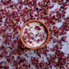 My rose-scented candle, hand-poured in a rustic terracotta jar and topped with dried rose petals. This is one of my most popular botanical options for a classic floral fragrance.