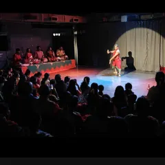 The magic of the spotlight in our black box space. Here, a Bharatanatyam dancer commands the stage during an intimate recital, with the audience just a few feet away, sharing every moment of the performance. This is what we mean by a connected experience.