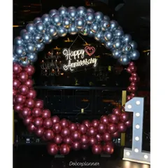 Celebrating a first anniversary is pure magic. For this special occasion, I created a statement balloon ring in chrome silver and ruby, with a "Happy Anniversary" neon sign and a light-up marquee number '1' to mark the beautiful milestone.