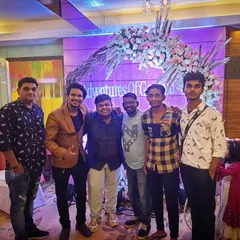 Our choreographers and event managers posing at a beautifully decorated wedding venue. We work closely with event planners to ensure our choreography seamlessly integrates with the event.