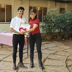 The EIRS Summer Camp is a fantastic opportunity for kids to immerse themselves in the world of horses. Here, a camper receives his certificate after a week of fun, learning, and riding.