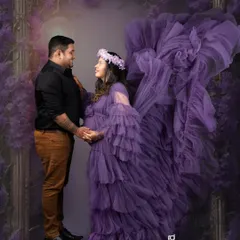 Creating a little bit of magic for your maternity session. This mother-to-be looks absolutely radiant in this flowing purple gown, set against a dreamy, enchanted forest backdrop that celebrates the fairy tale of new life.