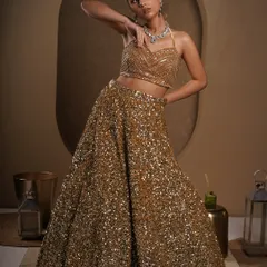 This dynamic pose shows the flow and structure of the lehenga skirt. It highlights the craftsmanship of the garment while adding a sense of movement and energy to the shot.