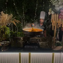 My chef serves a steaming portion of Mutton Nalli Barra, a popular live station dish that always draws a crowd with its incredible aroma and authentic taste.